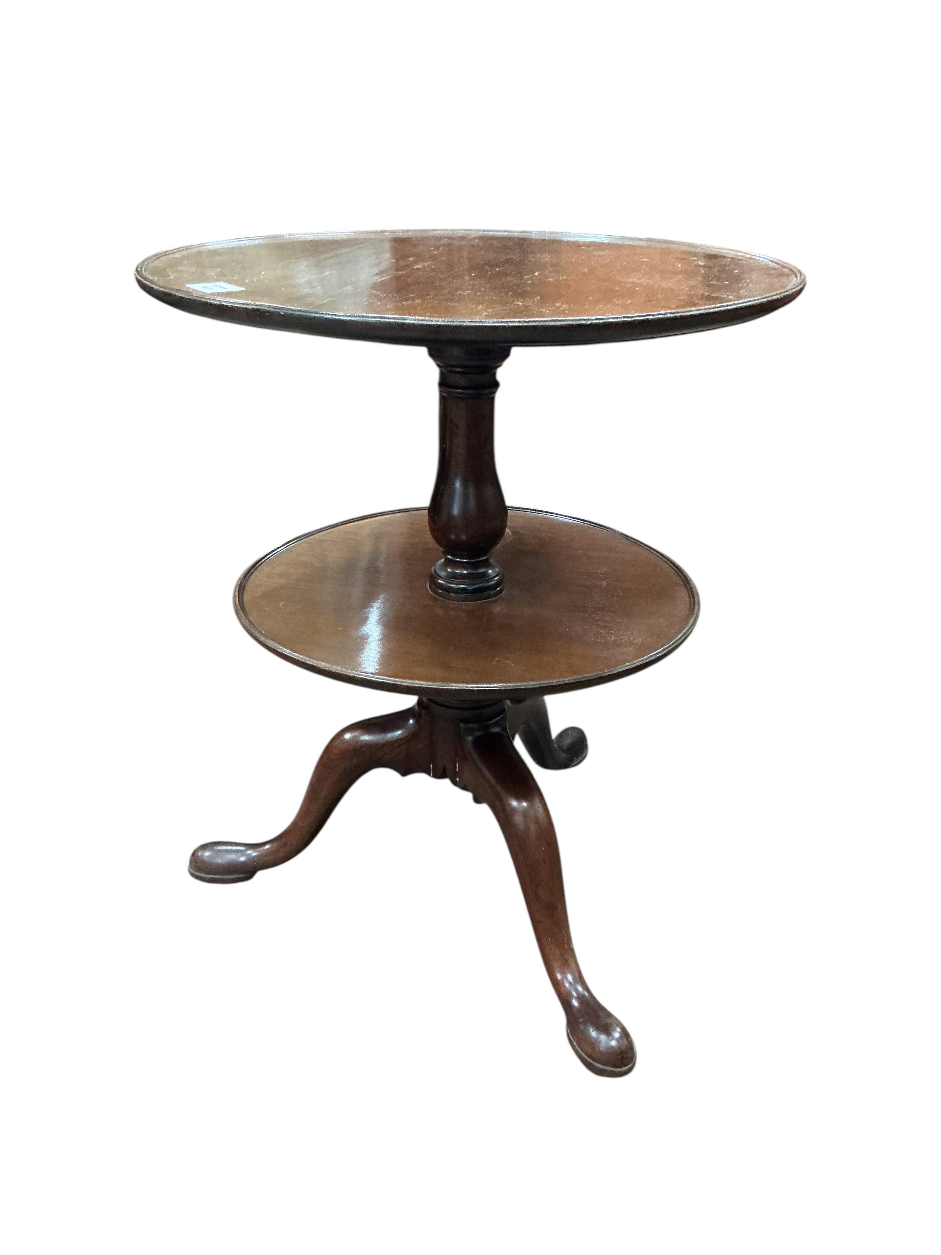 A George III and later circular mahogany two tier revolving dumb waiter, adapted, diameter 60cm, height 72cm